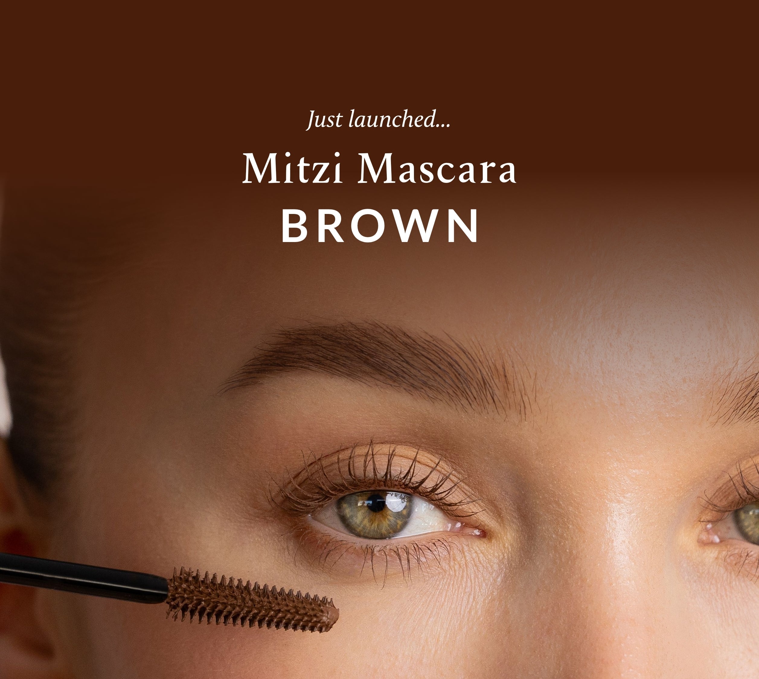 Close-up of an eye with Mitzi Mascara Brown mascara being applied, vegan natural-looking makeup