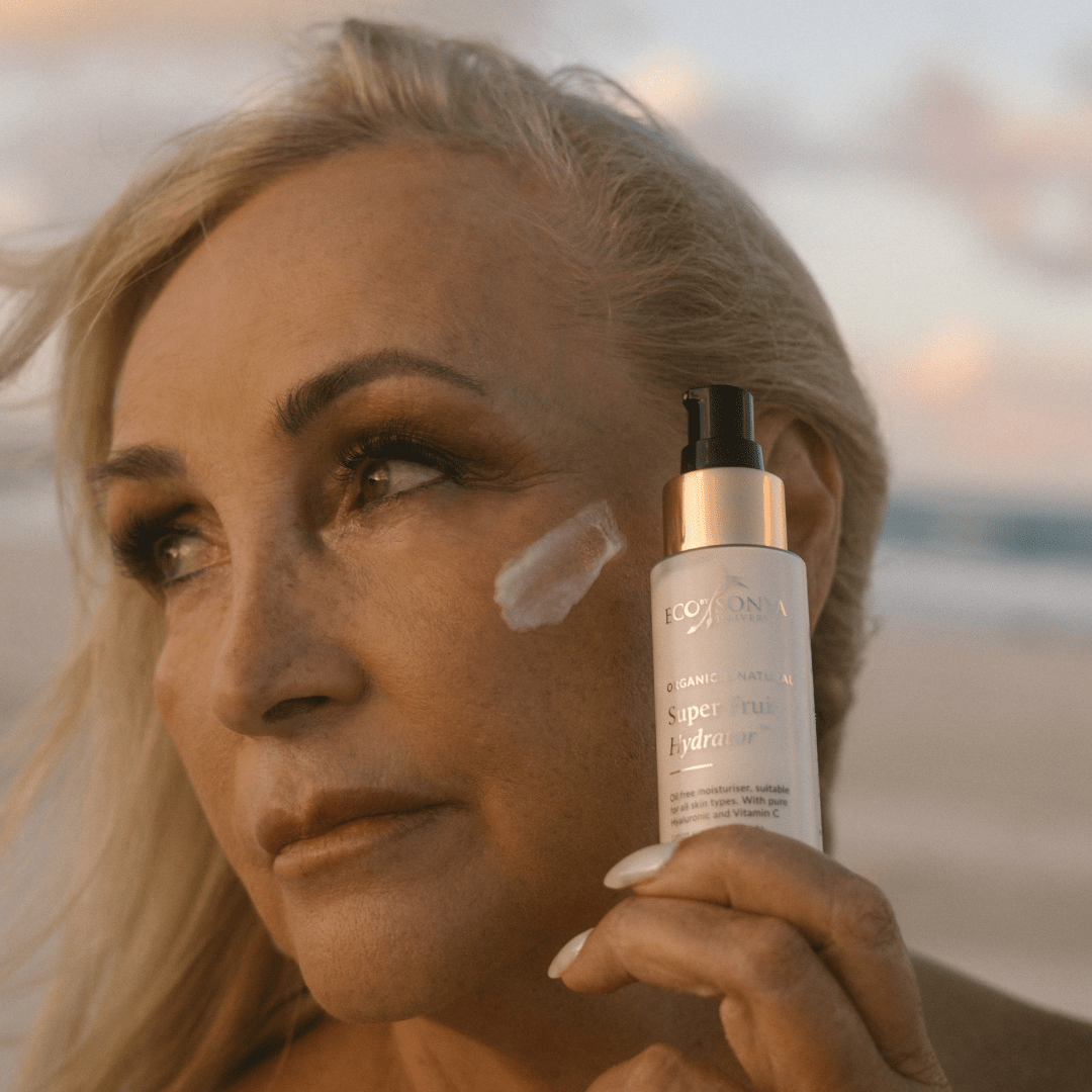 Eco by Sonya Super Fruit Hydrator smear on woman's cheek